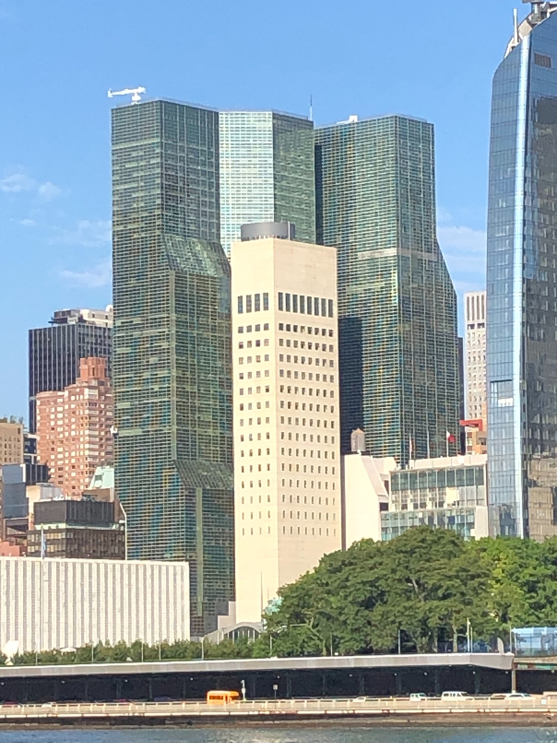 One United Nations Plaza / UN Plaza Hotel and office building — One United Nations Plaza and Two United Nations Plaza (the glass towers), with the New United States Mission to the United Nations in front (beige tower in center). Photographed in 2021; a current view, not a construction-period photograph.