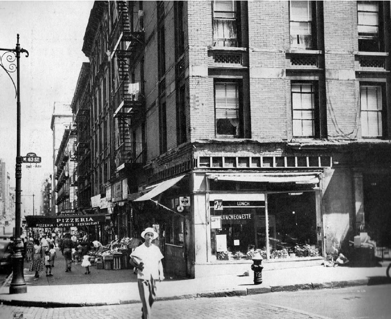 Princess Gardens — Lincoln Square Title I housing — Shows a picture of buildings and people on the sidewalk. Photographed in 1956.