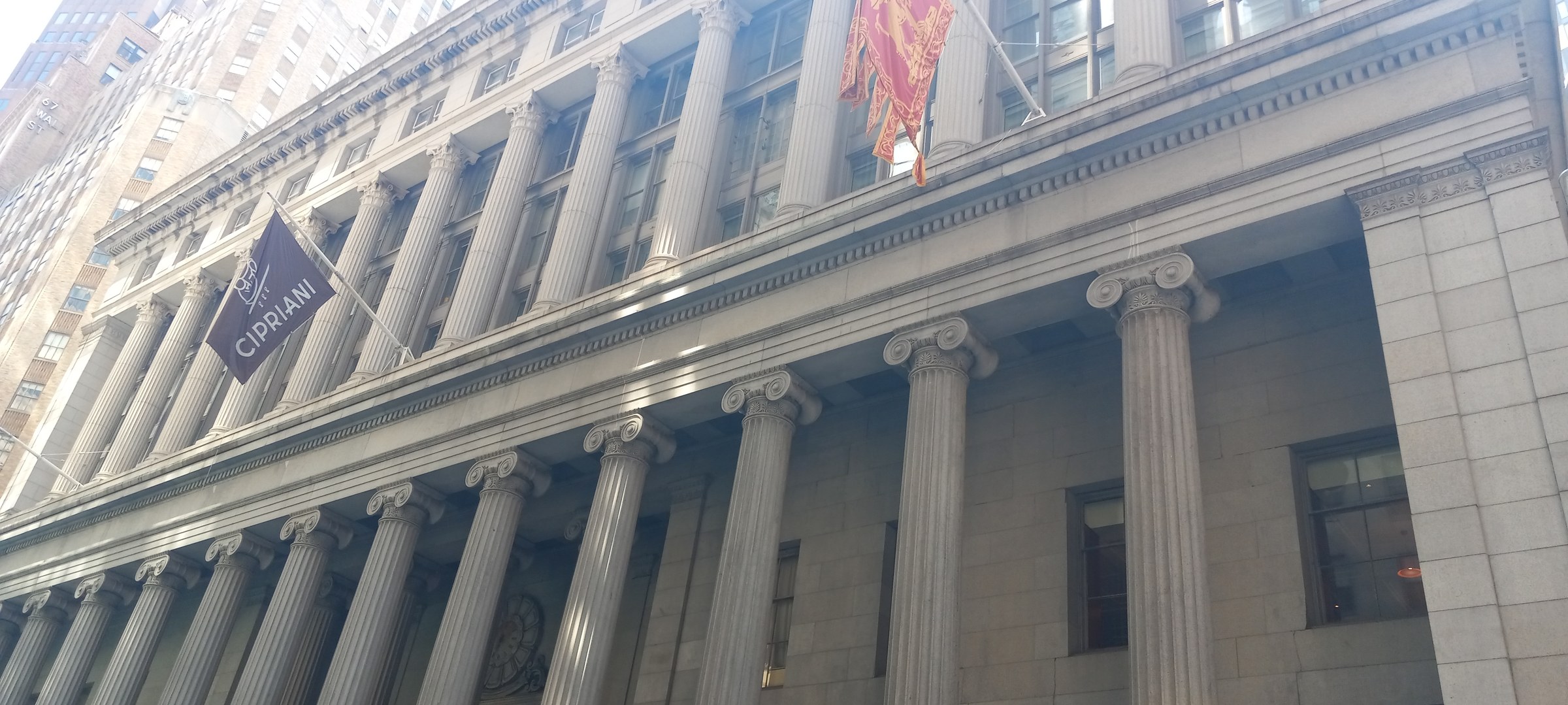 55 Wall Street — 1967 alteration — The colonnaded facade of 55 Wall Street, photographed in 2024.
