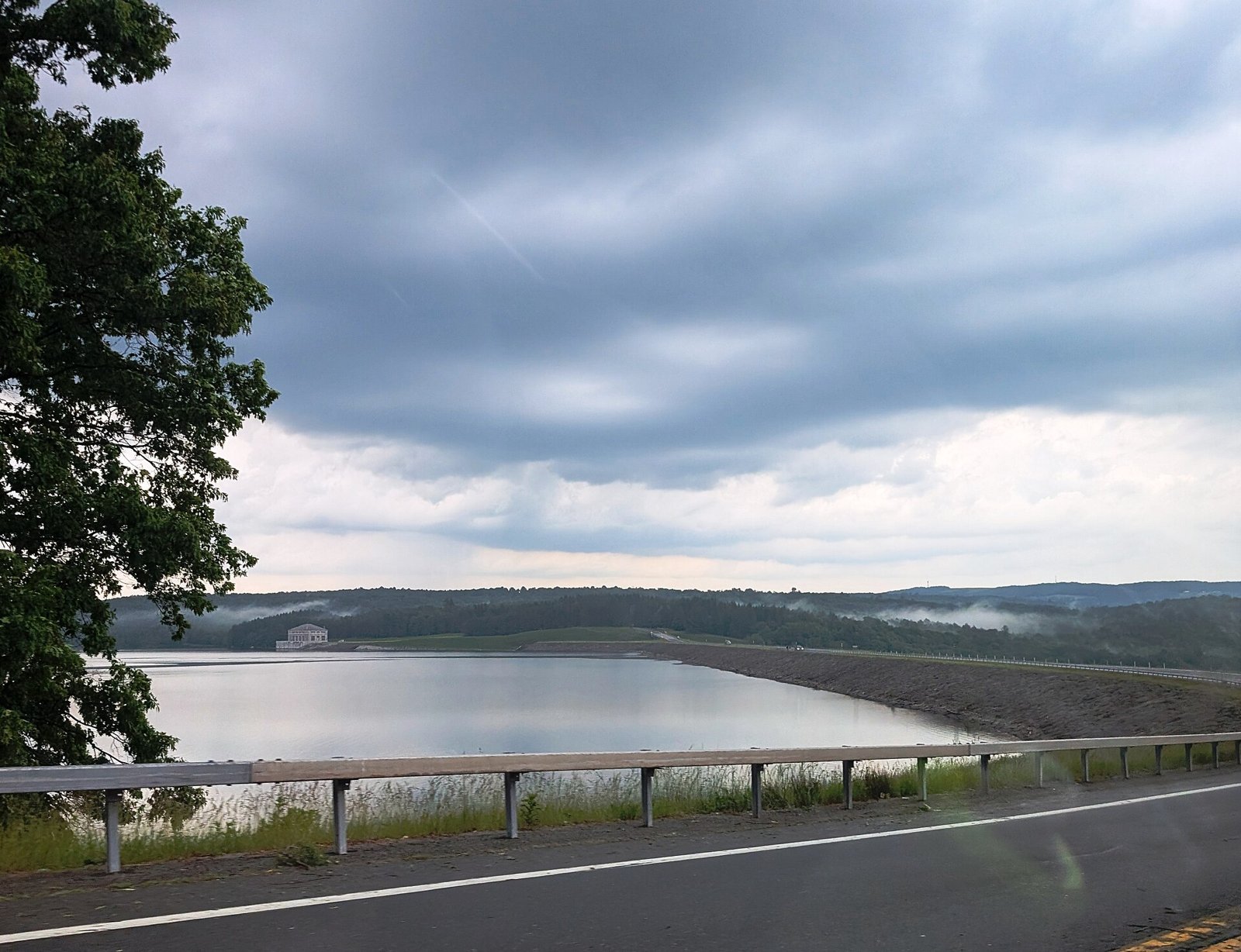 Neversink Reservoir and dam from NY 55, June 2026. The photograph shows the dam and reservoir, not the Grahamsville power house recorded on the list.
